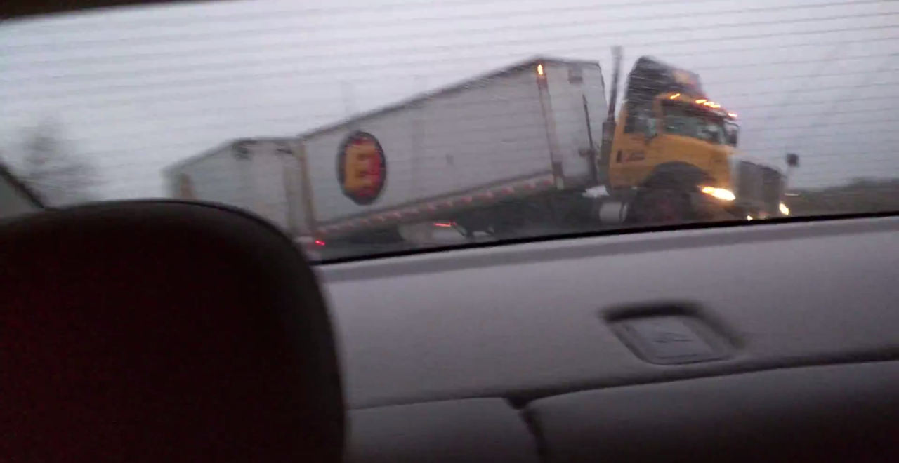 truck on black ice barely misses car